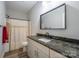 Bathroom offers a large mirror, vanity, and shower/tub combination with a shower curtain at 1700 Ivey Ct, Maiden, NC 28650