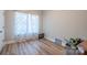 This cozy bedroom offers natural light, neutral walls and wood-look floors throughout at 1700 Ivey Ct, Maiden, NC 28650