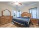 Bedroom featuring wood-look floors, a ceiling fan and staged with a bed and furnishings at 1700 Ivey Ct, Maiden, NC 28650