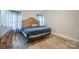 This comfortably sized bedroom has wood-look floors and is staged with a bed and furniture at 1700 Ivey Ct, Maiden, NC 28650