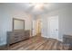 Light-filled bedroom boasts wood-look floors, closet, neutral walls and a ceiling fan at 1700 Ivey Ct, Maiden, NC 28650