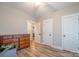 Bedroom with a ceiling fan, wood-look floors, closet, and multiple doorways at 1700 Ivey Ct, Maiden, NC 28650