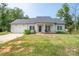 Inviting single-story home with attached garage, manicured lawn, and a welcoming front porch area at 1700 Ivey Ct, Maiden, NC 28650