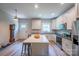 Bright kitchen features an island with seating, modern appliances and plenty of counter space at 1700 Ivey Ct, Maiden, NC 28650