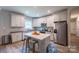 Modern kitchen with white cabinets, stainless steel appliances, and a functional center island at 1700 Ivey Ct, Maiden, NC 28650