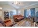 Comfortable living room featuring leather furniture, wood-look floors, and attractive decor at 1700 Ivey Ct, Maiden, NC 28650