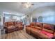 Spacious living room flowing into kitchen with stainless appliances and wood-look floors at 1700 Ivey Ct, Maiden, NC 28650