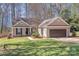 Attractive single-story home with a well-kept lawn, a paved driveway, and mature landscaping at 201 Remally Ln, Huntersville, NC 28078