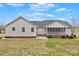 The back of the property features a screened porch and brick foundation at 207 Silver Creek Ln, Shelby, NC 28152