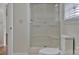 A door provides access to a walk-in shower in this bright bathroom at 207 Silver Creek Ln, Shelby, NC 28152