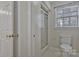 Bright bathroom with toilet and glass door walk-in shower at 207 Silver Creek Ln, Shelby, NC 28152