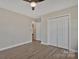 Bedroom featuring modern flooring, neutral walls, and double closets at 207 Silver Creek Ln, Shelby, NC 28152