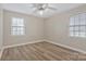 Bright bedroom with neutral walls, new flooring, and double windows at 207 Silver Creek Ln, Shelby, NC 28152
