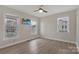 Bedroom featuring modern flooring, neutral walls, and large bright windows at 207 Silver Creek Ln, Shelby, NC 28152