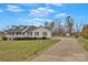 Property featuring a long drive and large lawn at 207 Silver Creek Ln, Shelby, NC 28152