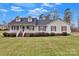 Charming home featuring a well-manicured lawn, inviting porch, and classic architectural details at 207 Silver Creek Ln, Shelby, NC 28152