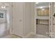 Open hallway leads into a study with built-in desks and a living room with large windows at 207 Silver Creek Ln, Shelby, NC 28152