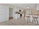 Bright kitchen with white cabinets, stainless steel appliances, stylish tile floors, and breakfast bar seating at 207 Silver Creek Ln, Shelby, NC 28152
