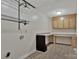 Functional laundry room features a long countertop, built in cabinets, and durable flooring at 207 Silver Creek Ln, Shelby, NC 28152