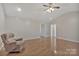 Spacious living area with hardwood floors and a comfortable armchair at 207 Silver Creek Ln, Shelby, NC 28152