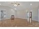 Open living room featuring vaulted ceilings, hardwood floors, and bright natural light at 207 Silver Creek Ln, Shelby, NC 28152