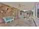 Relaxing screened-in porch featuring nautical decor and comfortable wicker furniture at 207 Silver Creek Ln, Shelby, NC 28152
