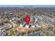 Aerial view shows modern townhomes in a wooded area near the Charlotte skyline, close to parking and local amenities at 208 Emerson Ave, Charlotte, NC 28204