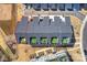 Aerial view of townhomes with rooftop patios, highlighted by a red outline around the left-most unit for emphasis at 208 Emerson Ave, Charlotte, NC 28204