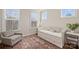 Bright bedroom with daybed, area rug, and natural light from multiple windows at 208 Emerson Ave, Charlotte, NC 28204