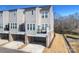 Modern townhome featuring a private balcony and an attached garage at 208 Emerson Ave, Charlotte, NC 28204