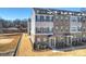 Exterior view of townhomes with gray siding and rooftop decks at 208 Emerson Ave, Charlotte, NC 28204