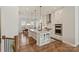 Bright, modern kitchen with island, stainless steel appliances, and granite countertops at 208 Emerson Ave, Charlotte, NC 28204