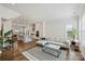 Open-concept living area with modern decor, hardwood floors, and seamless kitchen view at 208 Emerson Ave, Charlotte, NC 28204