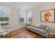 Bright sitting room with hardwood floors, natural light, and comfortable seating at 208 Emerson Ave, Charlotte, NC 28204