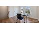 Office with dark desk and a modern chair and hardwood floor at 208 Emerson Ave, Charlotte, NC 28204