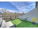 Outdoor rooftop patio featuring artificial turf, seating, and a relaxing chaise lounge at 208 Emerson Ave, Charlotte, NC 28204
