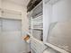 Well-organized walk-in closet featuring custom shelving and storage solutions at 208 Emerson Ave, Charlotte, NC 28204