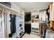 Organized walk-in closet with custom shelving, hanging rods, and ample storage space at 208 Emerson Ave, Charlotte, NC 28204