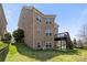 Expansive backyard showcasing a multi-level deck and brick exterior of the home at 2251 Barrowcliffe Nw Dr, Concord, NC 28027