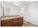 Bathroom featuring dual sink vanity and shower-tub combination, offering practical space at 2251 Barrowcliffe Nw Dr, Concord, NC 28027