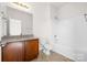 Bathroom with granite countertops and tub with shower for a relaxing experience at 2251 Barrowcliffe Nw Dr, Concord, NC 28027