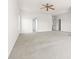 A spacious bedroom with neutral carpet, large windows, and multiple doorframes creating an airy atmosphere at 2251 Barrowcliffe Nw Dr, Concord, NC 28027