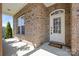 Charming front entryway with a 'Welcome' mat and a white door with glass panels at 2251 Barrowcliffe Nw Dr, Concord, NC 28027
