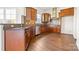Well-equipped kitchen featuring stainless steel appliances, granite countertops, and wooden cabinets at 2251 Barrowcliffe Nw Dr, Concord, NC 28027