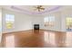 Spacious living room featuring a fireplace, hardwood floors, and plenty of natural light at 2251 Barrowcliffe Nw Dr, Concord, NC 28027