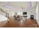 Inviting living room featuring a fireplace, hardwood floors, and an open floor plan at 2251 Barrowcliffe Nw Dr, Concord, NC 28027