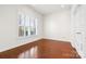 Clean office space with hardwood floors, plantation shutters, and ample natural light at 2251 Barrowcliffe Nw Dr, Concord, NC 28027