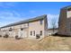 Backyard featuring a small patio with outdoor seating, perfect for relaxing and entertaining at 2259 Crosscut Dr, Charlotte, NC 28214