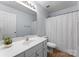 Well-lit bathroom featuring a single sink vanity and a shower-tub combination with a stylish curtain at 2259 Crosscut Dr, Charlotte, NC 28214