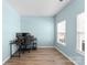 Bedroom with dual monitors, desk, wood flooring and natural light from the window at 2259 Crosscut Dr, Charlotte, NC 28214